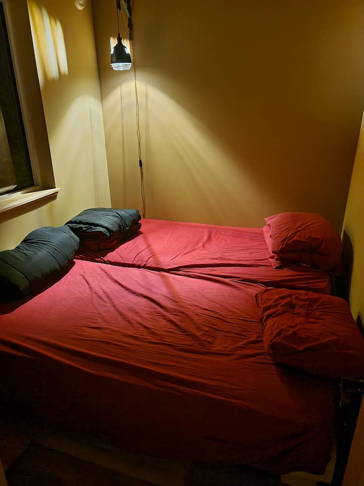 These are two twin size beds. If you want more space and only need one bed in this room, you can put one mattress on top of the other and push the bed from towards the wall, as shown in the other photos.