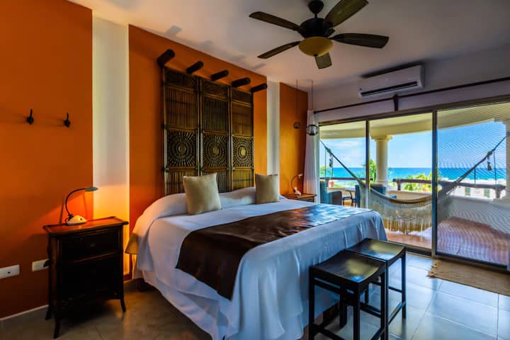Villa King Bed Orange Room with Ocean View Balcony