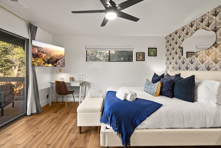 Primary bedroom with King bed, private viewing deck and ensuite bathroom 1. Crazy Red Rock views through this slider.