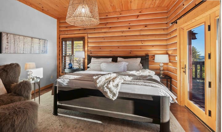 The master bedroom has a king-size bed and an exterior door to the expansive wrap-around deck with amazing Rocky Mountain views.  An ensuite bathroom is attached to the master suite.