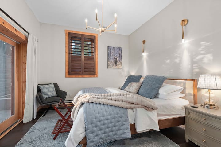 A third king bedroom down on the walk-out level has its own door to patio and a closet. 