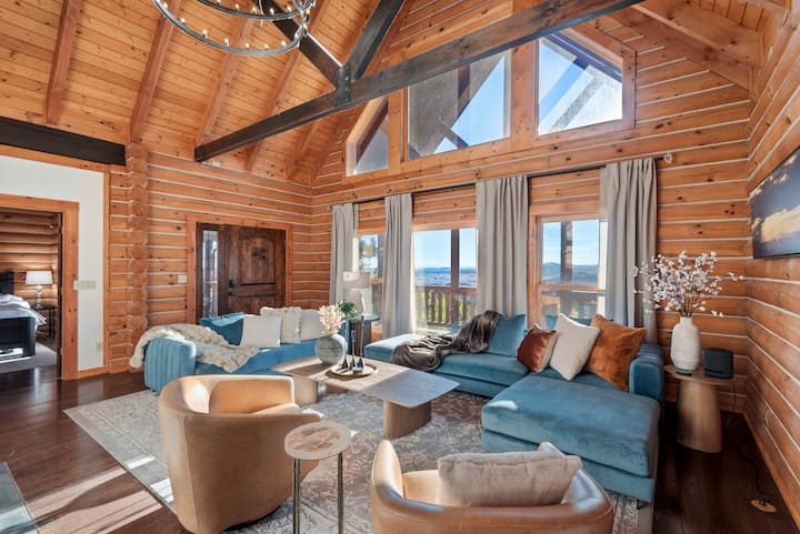 Modern, cozy seating for all to gather by the two-story fireplace and enjoy fabulous high-up views of the Rocky Mountains. Sunrise and sunsets here are magical.