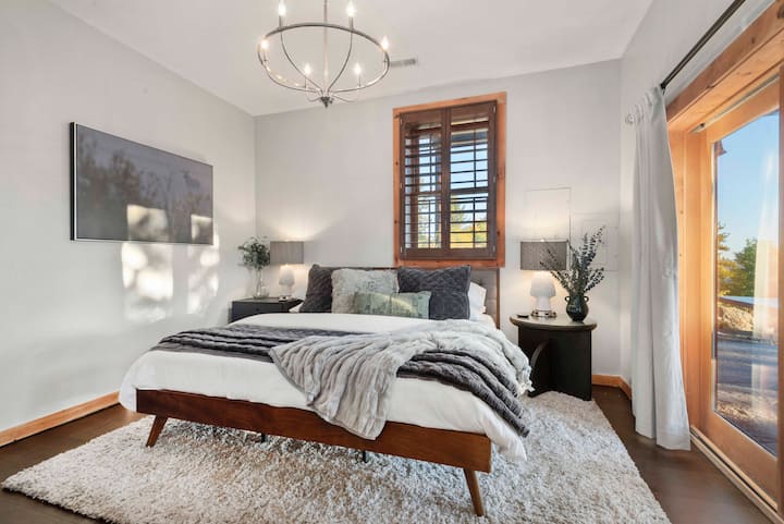 Second master suite downstairs at walk-out level has its on door to patio, mountain views, and an en-suite attached bathroom. 