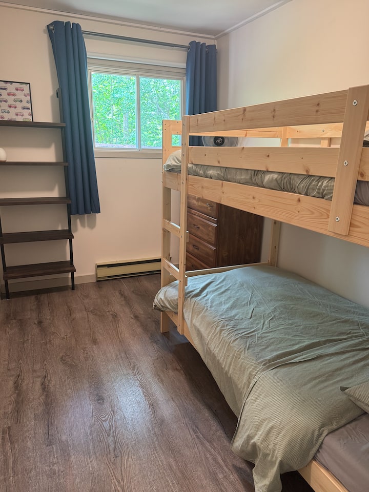 Twin bunks with dresser and shelving unit
