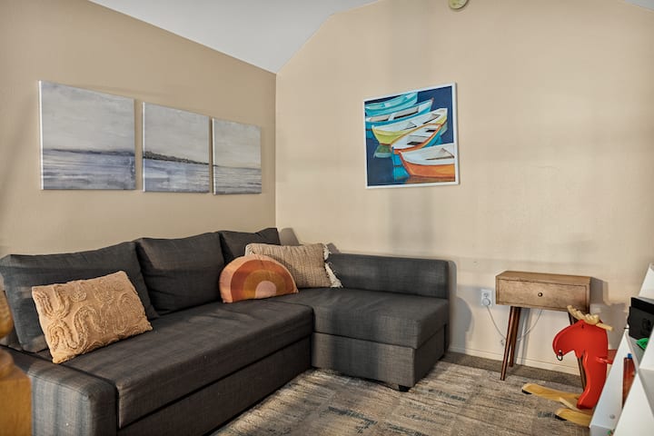 The Big Bear Lake retreat offers an upstairs loft area with a pull-out bed, a comfortable sofa for relaxation & reading material for a cozy retreat.