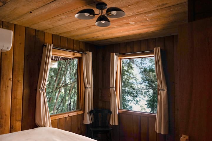 2nd bedroom with some of the best and most peaceful views to wake up to. + Blackout curtains for when you need some other, smaller people to sleep in a longer. This room has a secret treasure compartment, so see if you can find it when you stay!