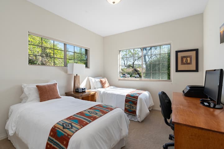 Second downstairs guest bedroom includes a TV with a few cable channels, desk with printer (if you download the HP app, you can connect/print), and full-size closet with extra blankets. Red Rock, Hiking, Mountain Biking, Trails, Vortex, Views, Condo