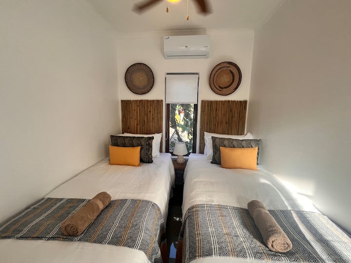 The twin room has air conditioning and ceiling fan, as well as built in wardrobes that offer plenty of storage.