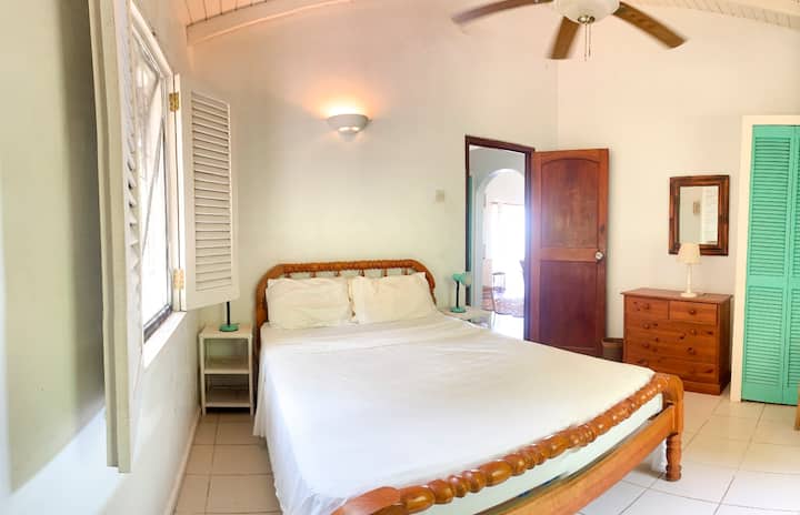 Bedroom #2 in Upper Apartment. Mosquito nets available. Screened windows, ceiling and pedestal fans. 
