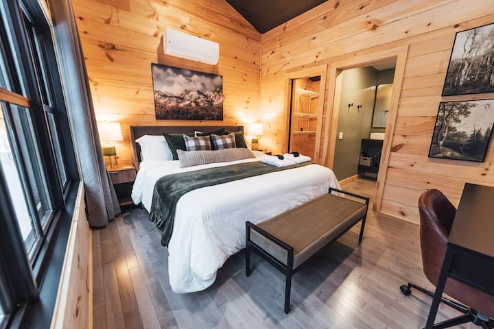 Bedroom #1- Comfy King Bed with en-suite bathroom, Black Out Curtains, Ceiling fan, Walk in closet, Desk, 50 inch smart TV.  Mountain Views!  Located on the main level.