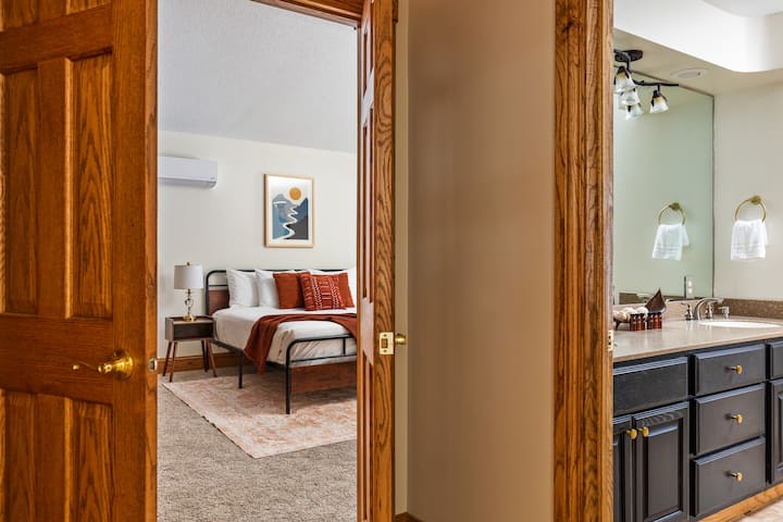 The primary bedroom and en suite bathroom provides a private sanctuary from the rest of the home. 