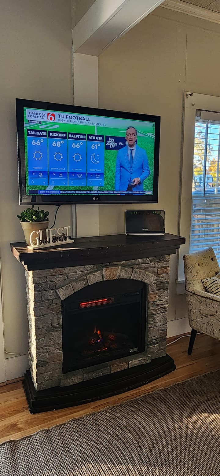 Remote control electric fireplace warms the room