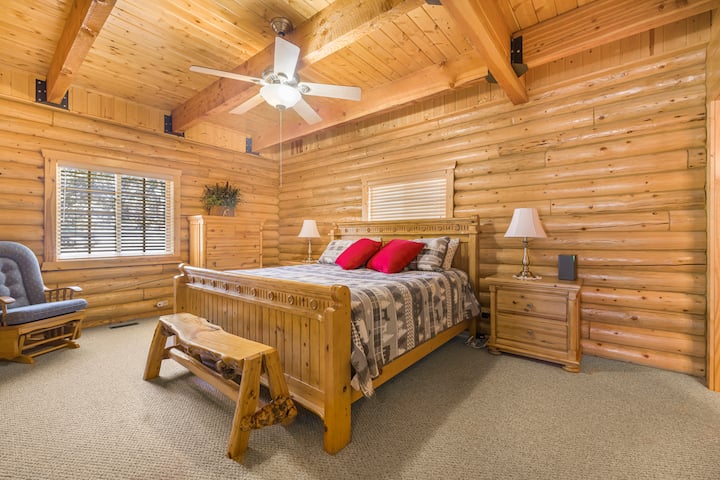 A bedroom features a king bed.