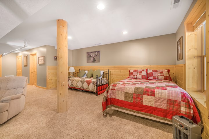 Downstairs area has a trundle bed with two twin beds and a queen bed. 