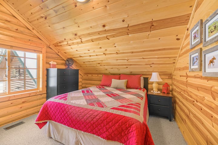 A bedroom with queen bed
