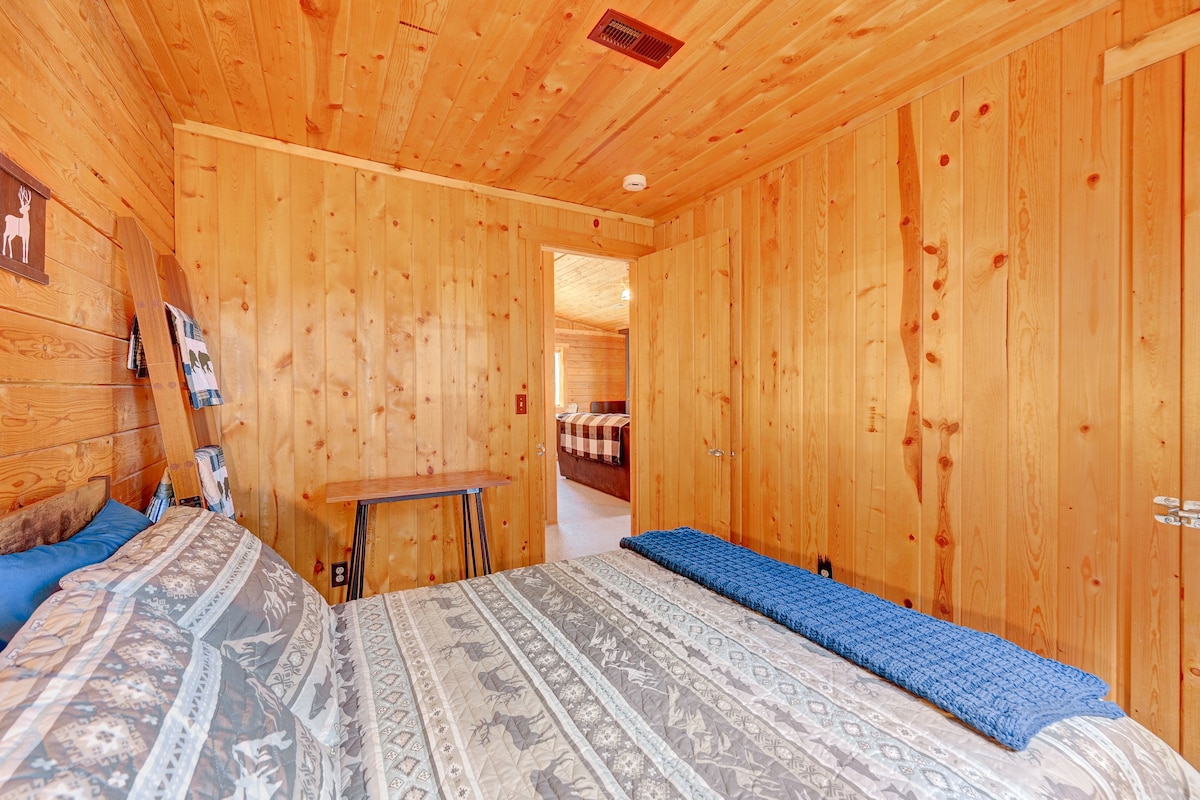 Here’s another perspective of the bedroom, showcasing its inviting atmosphere and the beautiful wooden accents that create a warm, rustic feel.
