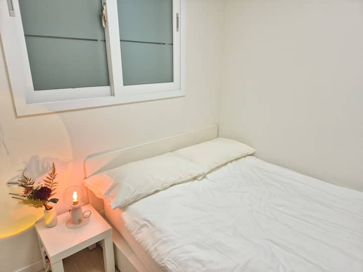 We have a double-sized bed and hotel-style luxury bedding.