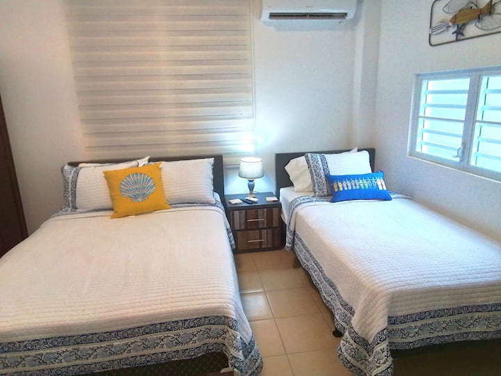 Playero bedroom consists of a Full Size Bed and a Twin Size Bed, a dresser, a night table and closet space.  The room has air condition and a TV with Basic Cable.  The decoration of this room blends in with the beach concept.  