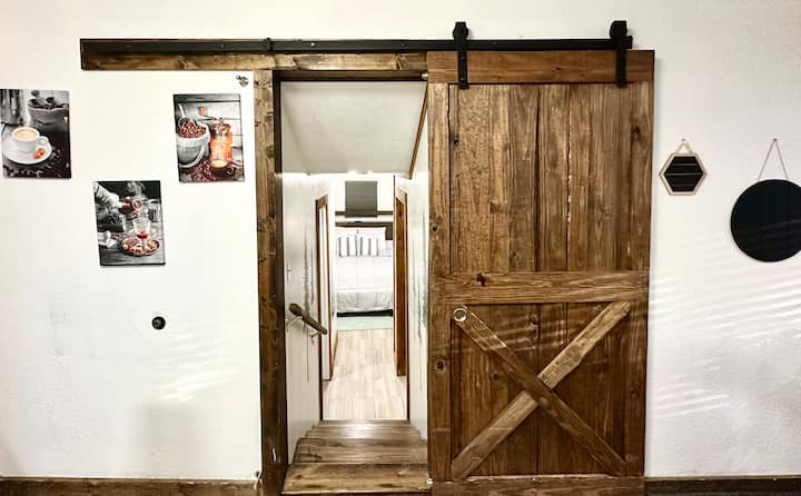 Beautiful barn doors to enter master bedroom and bath.