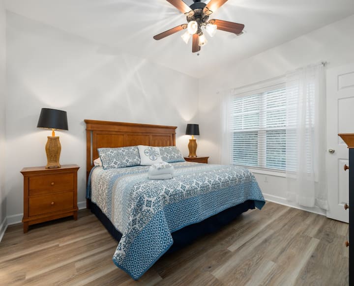 The primary bedroom has a king bed, smart TV with streaming capabilities, a closet and dresser for your belongings, and attached en suite bath. North Myrtle Beach, Ocean, Beaches, Pool, Pet Friendly, Family, Golf, Homes, Condos, Private