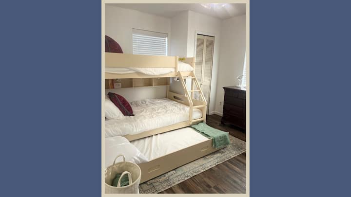 Our East Bunkroom offers sleep for 4 with a twin over full bunk and twin trundle bed, along with a private half bath and closet. 