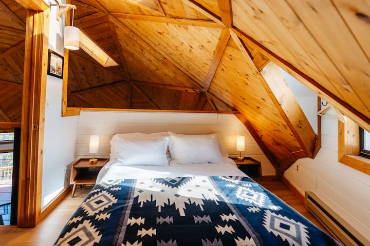 Please note this is a loft bedroom with privacy curtain and 1/2 wall that overlooks the living room.
