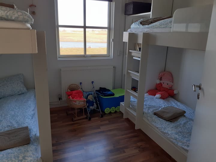 The bunk room with four beds, chest of drawers