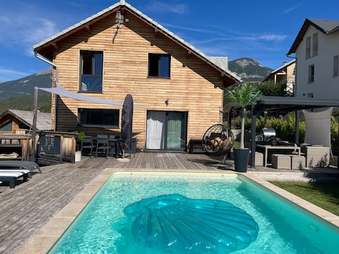 House between lake and mountain......