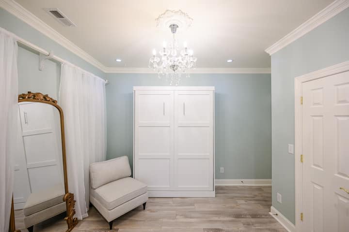 Queen-sized pillow-top murphy-bed, closet space, shared main-floor restroom, and an amazing view of the west side of the property.  This room has French doors with curtains for privacy, and is commonly used as a dressing room by bridal parties.