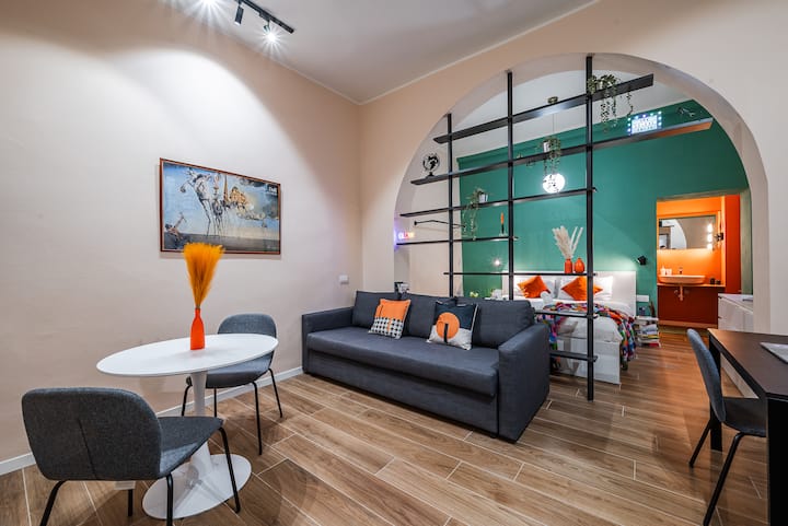 Welcome to tHE Colors Suite! Immerse yourself in a vibrant, stylish open-space retreat near Piazza Duomo, where rich teal and warm orange accents bring artistic energy to your stay.