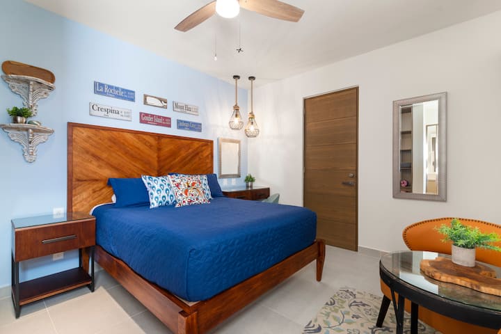 Queen bedded room with private entrance to the outside, and an adjoining door to the main part of the spacious condo.  