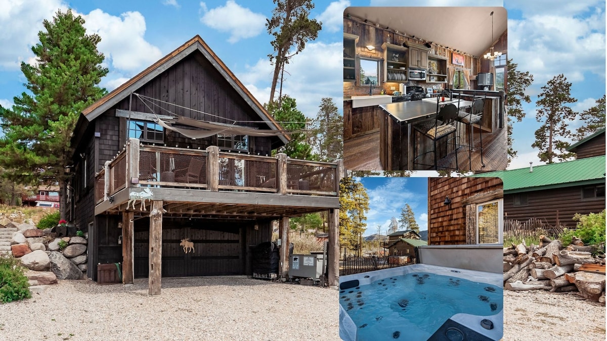 The chalet's exterior showcases a rustic design with dark wood accents, complemented by a spacious deck featuring outdoor furnishings. A glimpse of the kitchen area highlights modern appliances against a backdrop of reclaimed wood. The private hot tub is presented in an inviting outdoor setting, surrounded by nature.