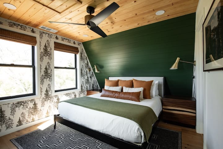 The master bedroom ✨ Private bath, plush vibes, and those dreamy A-frame angles you’ll wake up smiling to.