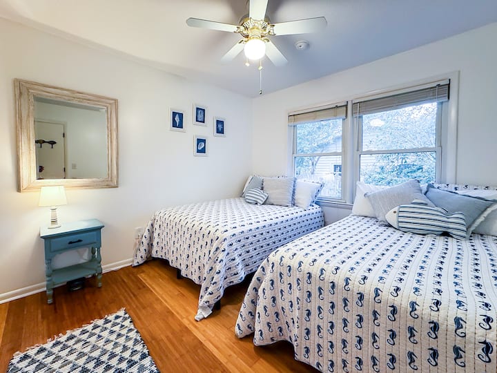 The Little Blue Whale is an irresistible bedroom with two full beds having a 
simple, quaint nautical vibe. 