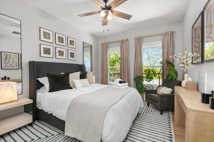 Enjoy a comfortable night's sleep in the downstairs queen-size bedroom, offering a cozy and relaxing space.
