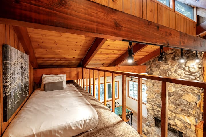 Loft Bedroom Nook – Cozy up in this charming loft with views overlooking the main living space.