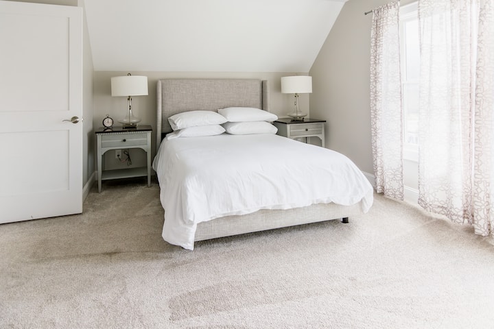 Upstairs bedroom with queen bed and private bathroom