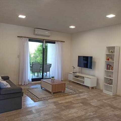 Successful Airbnb property: Apartment on the ground floor with a garden in a gated neighborhood, meters from Panamericana in Partido Del Pilar