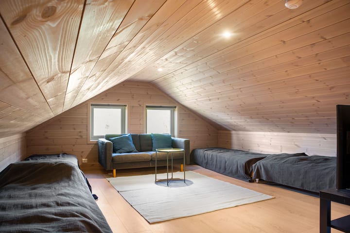 Separate loft with four single beds, a two-seater sofa and a TV with extra HDMI cable if you want to connect your own Apple TV, Google Chromecast or game console.