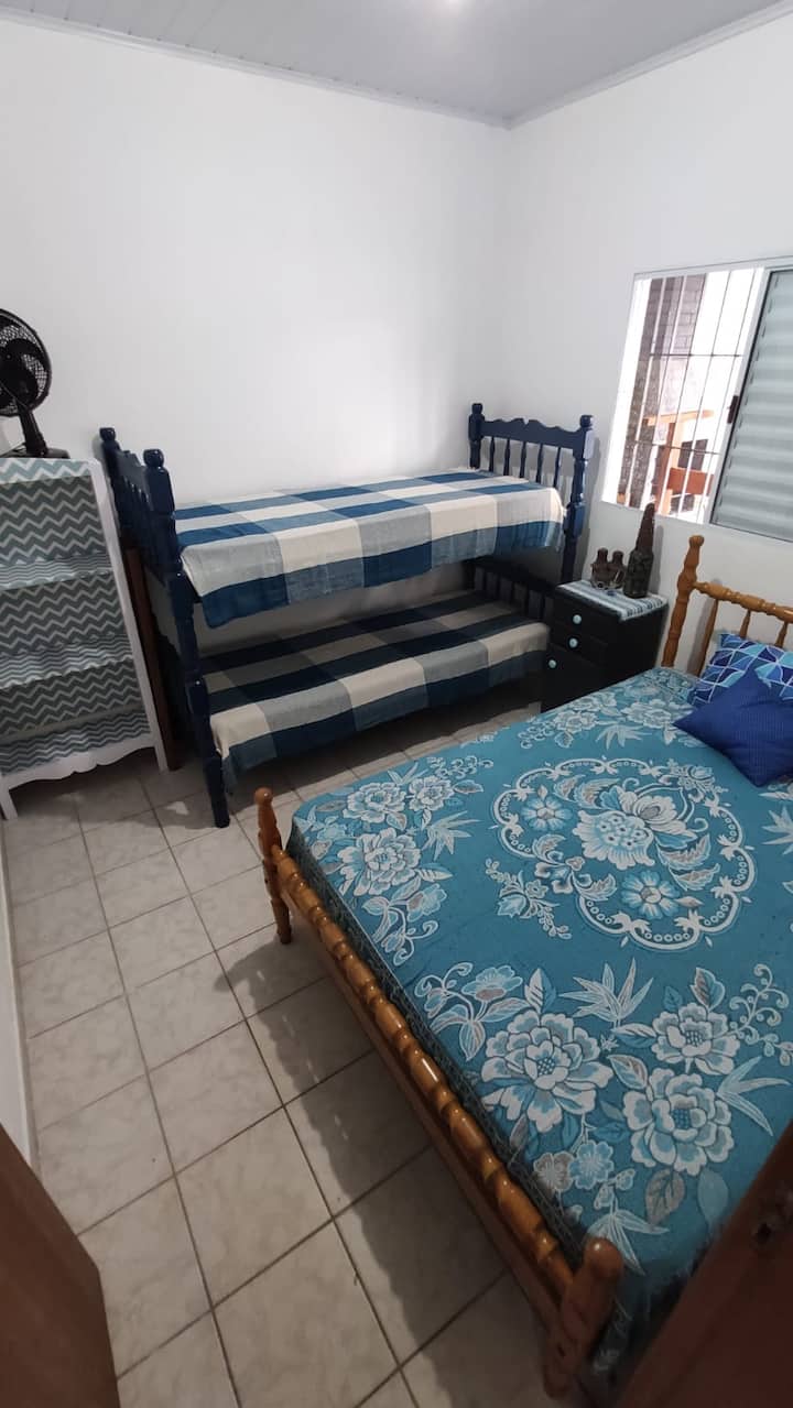 Cozy room with place for 4 persons (1 double bed and 1 bunk bed). Cabinet and bedside table for storing items. Portable fan, ideal for heat days. 