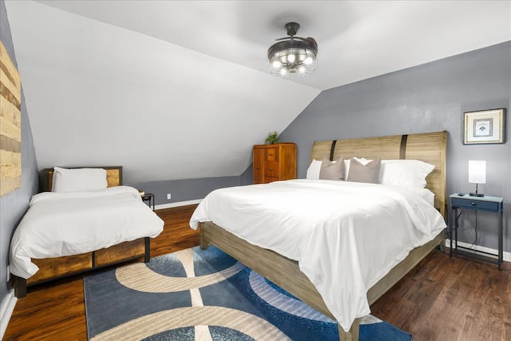 Bedroom 4: Located on the second floor, this bedroom features a king-size bed and a twin/single-size bed.