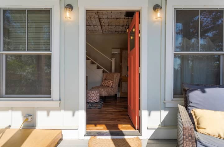 
Private pool house entrance with its own porch and seating, offering a separate and peaceful stay. Just steps from the pool, this fourth bedroom provides added privacy and a charming indoor-outdoor retreat.