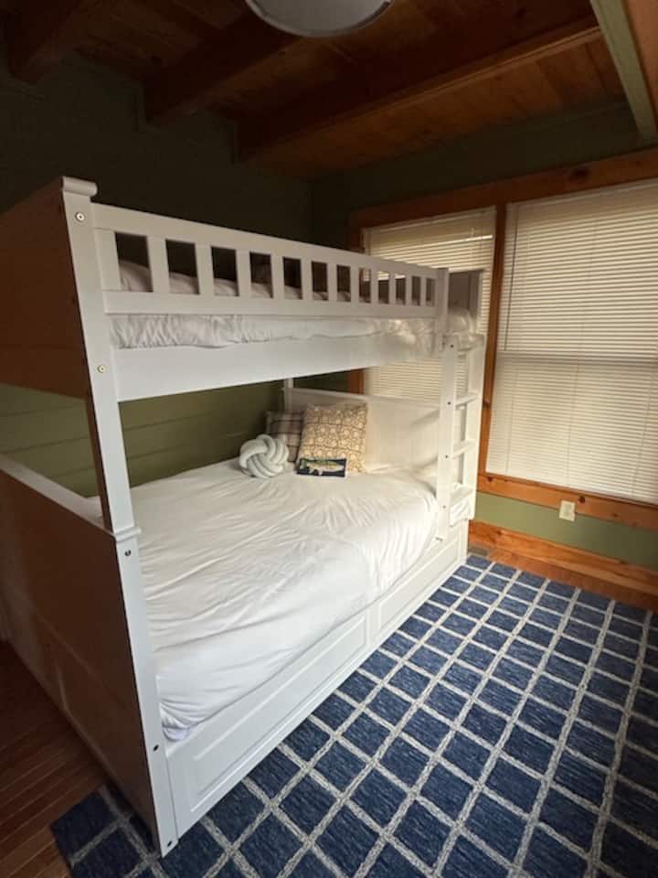 This bedroom has a spacious Full over Full bunk perfect for the kids or 2 adults.  There is a full closet and a TV.