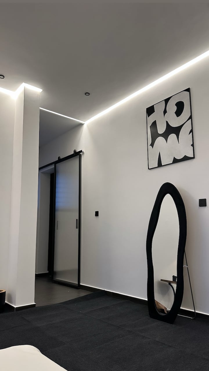 Home art paired with a minimal mirror adds a touch of elegance and depth, blending creativity with modern simplicity.
