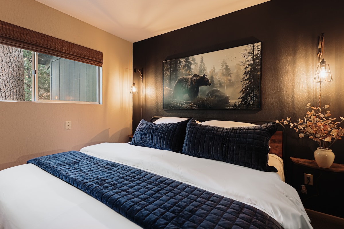 Lower Bedroom - Luxurious King-size bed with modern rustic charm. 