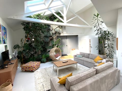 Renovated artist's studio with indoor gardens