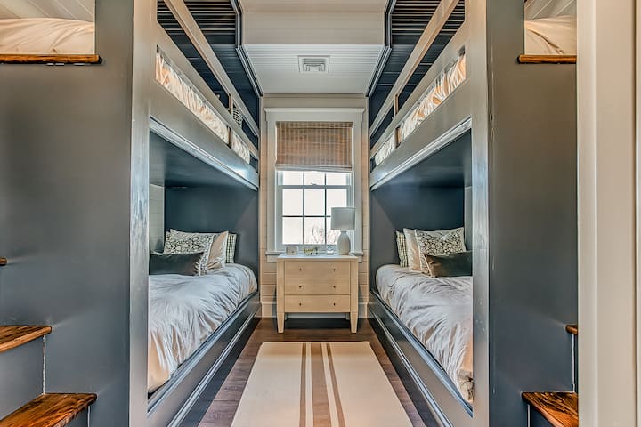 Main House
Lower level bunk room with 4 twin beds. 
Each bed has a reading light and outlet.