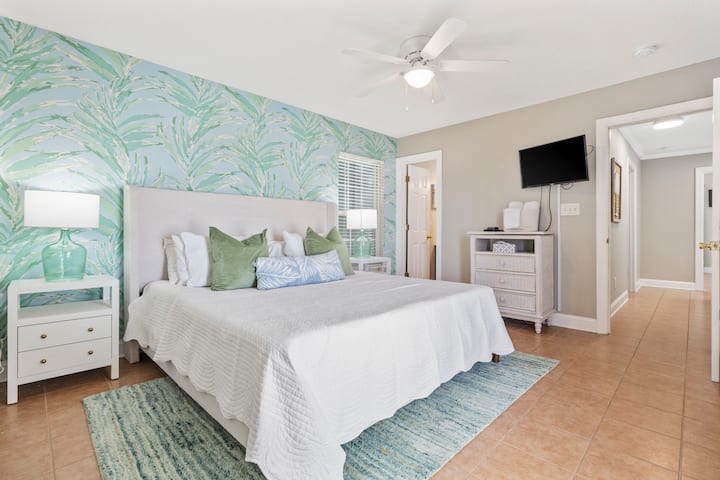 Step into your serene sanctuary—this inviting bedroom features a refreshing palette of green and blue tones that evoke calm and coastal charm.