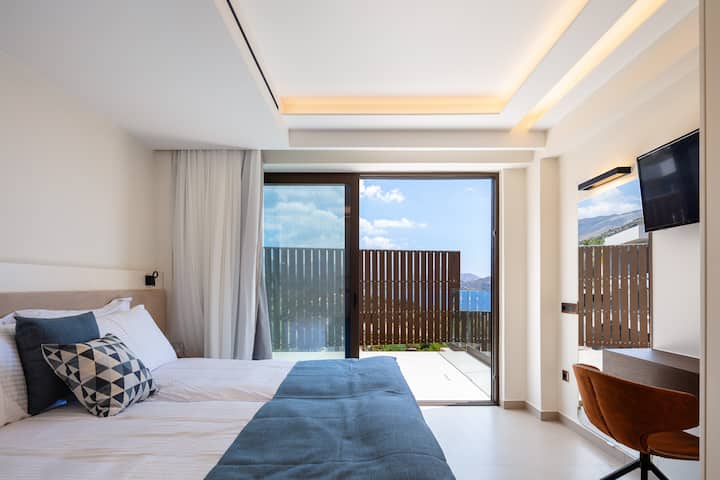 The bedroom on the ground floor of the Gamma home has  big private terrace