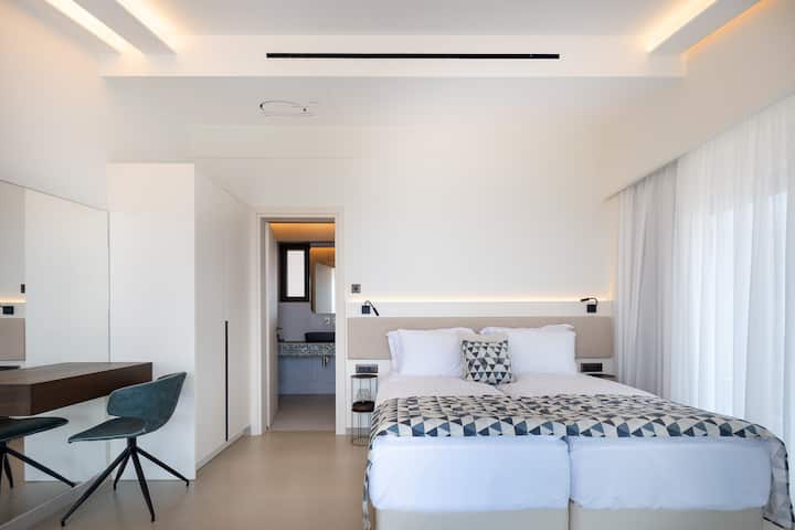 The bedroom on the second floor of the Gamma home has a big balcony with a sea panoramic view.